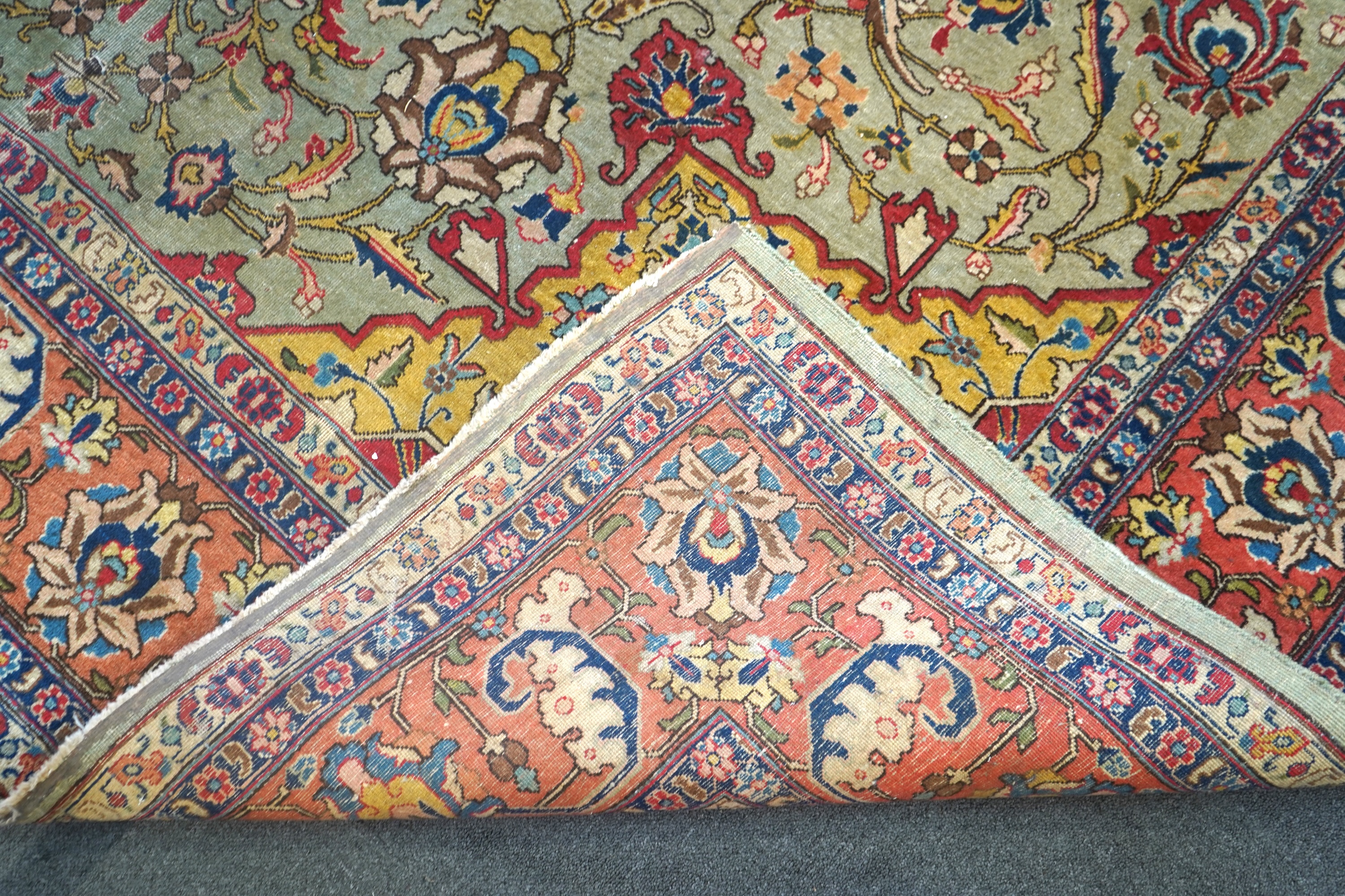 An early 20th century Tabriz pale green ground carpet